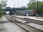 The commuter train takes the switch to go up the suburban branch to Gresham.