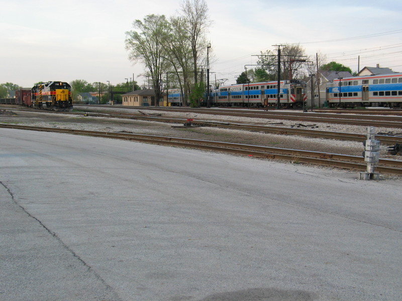 Outbound Metra electric arrives at Blue Island while the IAIS westbound waits to depart, May 2, 2007.