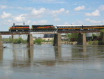 Westbound with passenger cars crosses the Iowa River, May 8, 2009.