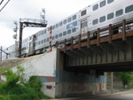 Inbound Metra crosses Broadway St. in Blue Island.  If you look closely a RI herald can still be seen on the bride girder.