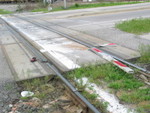 Here are the unfortunate results of a train running over a crossing arm knocked over by a motorist!  At Broadway st. near Blue Island crossing.