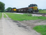 Westbound pulls down the siding while the ballast train holds the main, July 16, 2008.