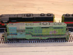 Overhead shot. The IAIS lettering is from Microscale Condensed RR Gothic sets 93-1 (white) and 93-6 (yellow), combined to reflect the wear that is apparent on the prototype. Note that the "W" is actually an "M" turned upside down, as per prototype. Portions of Precision lettering still visible underneath. Also visible in this view is the weld line on the cab roof, 18" back from the cab face, apparently from when the short hood was replaced. Roof was weathered with Floquil Grimy Black.