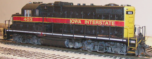 Rear conductor's side view. Note IC orange showing through along frame and under radiator compartment. 403's two different styles of radiator fans can be seen in this photo, as well as the different cut bar types on the rear pilot (looped top on engineer's side, straight on conductor's).
