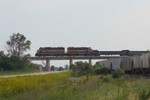 627 and 602 cross the highway at Hancock.  710 and 600 were dropped to drag a cut of hoppers back to Council Bluffs