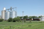 Passing eastward through Malcom, IA