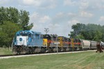 LLPX 2807, leading the three other SD38-2s and the returning CRIC, creeps through the curve and upgrade at Fairfax, IA.  The units are going all-out to lift the sizable train up the stiff grade ahead.
