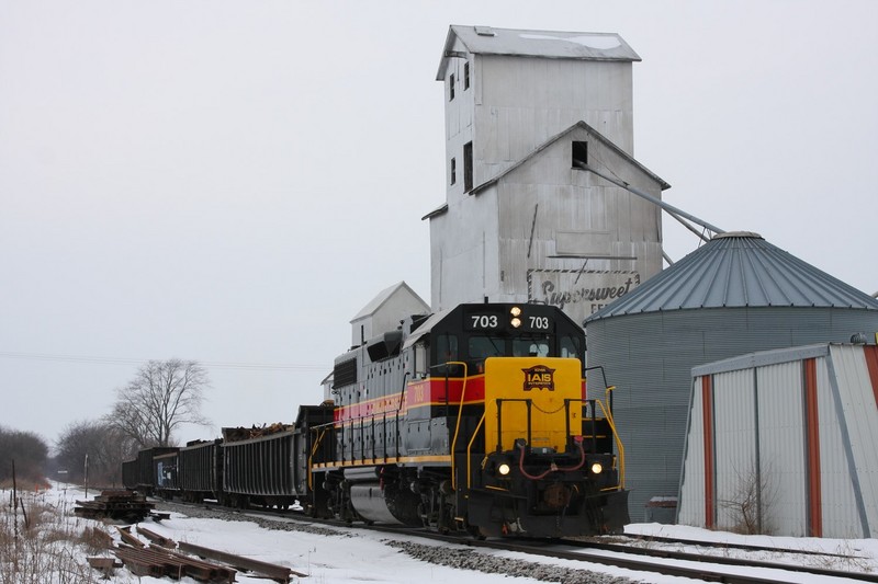 IAIS 703 with the local at Downey, accelerating again after waiting for a track inspector to clear up