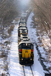 IAIS  702 charges up the bluff and is about to pass under Brady Street in Davenport on Friday, 23-Dec-2005