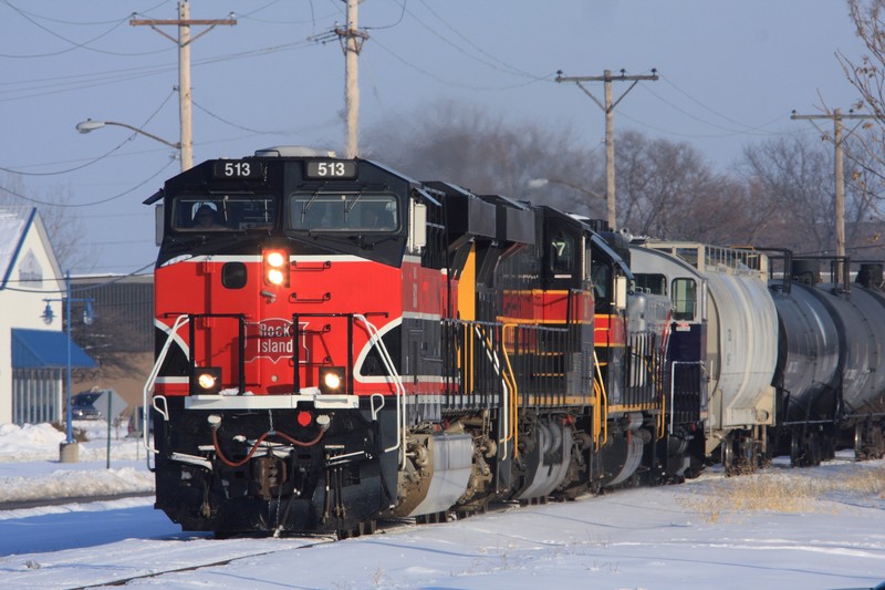 Two and a half hours after we first found him in Silvis, 513 and train are underway again at East Moline.  There's now a large cut of empty ethanol tanks on the front end.