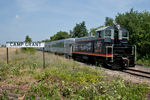 CB&Q 9255 pulls the Nebraska Zephyr south past the BN Camp Grant station sign near the Rockford, IL airport.