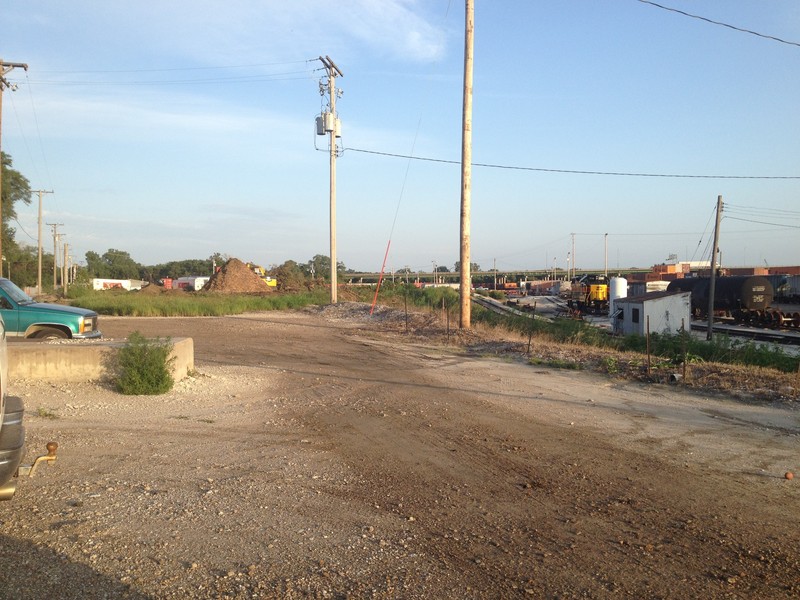 Looking south from the Bluffs employee parking lot at the recently-graded lot for the new yard office.