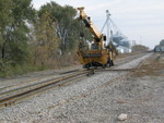 Placing the new rail inside the gauge, before removing the old rails on the south side, at mp 208, Liberty St. Wilton.