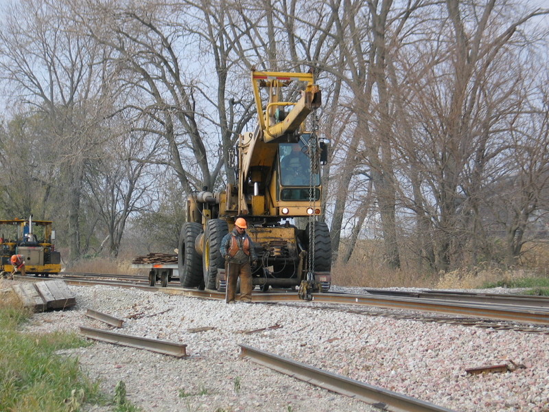 Swinging the new rail into place.