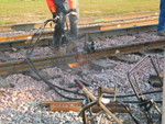 Cutting the rail at the depot crossing in Wilton, in preparation for welding the joint, Nov. 12, 2007.