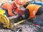 Fitting the crucible, which hold the liquid metal during welding, to the rail.