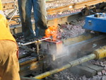 Preheating the rail prior to welding.