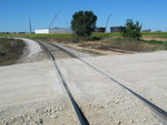 Looking west still; the track remnant in the road was the siding known as "East Menlo" in RI days.