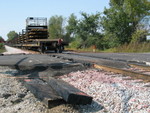 210 crossing.  The track gang has pulled the planks out in preparation for laying the new rail next to the existing rail.