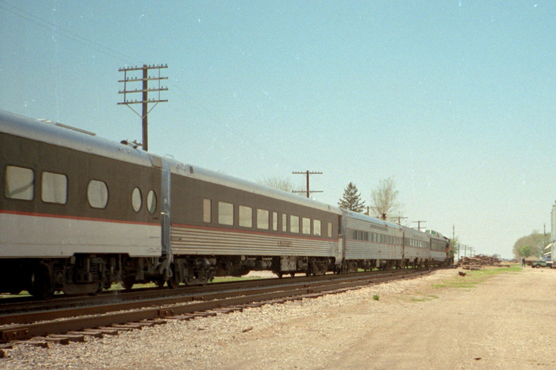 A look down the length of a westbound train, behind IAIS 250