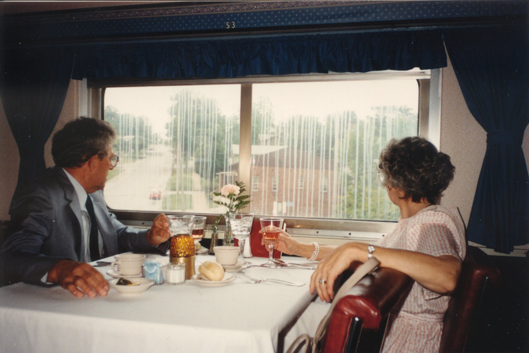 On board the QCR, showing the car interior and dining setup.  Those would be my maternal grandparents, Harold and Jane Bryant