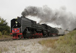 IAIS 7081 heads west with 8 cars on a break in run at County Line Rd west of Oxford, IA on 09-Sept-2006.