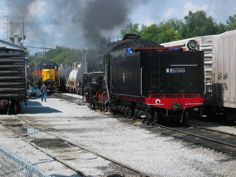 Pulling west on 4 track.  With the turn blocking the siding, the steam engine had to get onto the main at the west end of the yard.  The enginehouse guys moved the 4 geeps (off the morning's inbound turn) out of the way to let the steamer through.  Sept. 7, 2006.