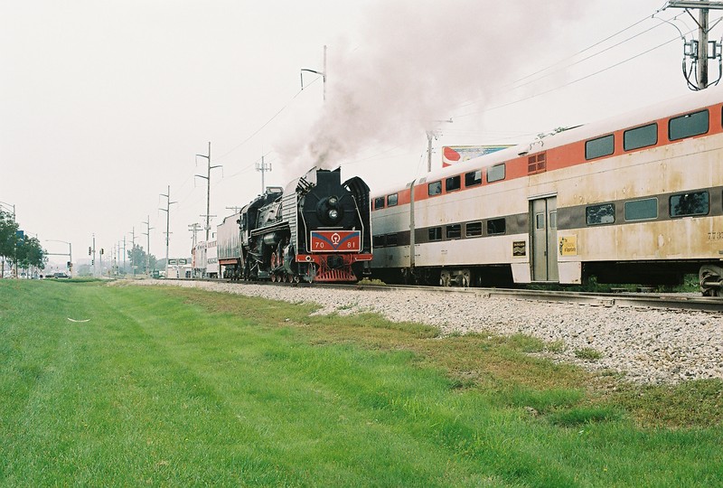 Steam engine backing past the commuter train after the Sept. 9th test run.