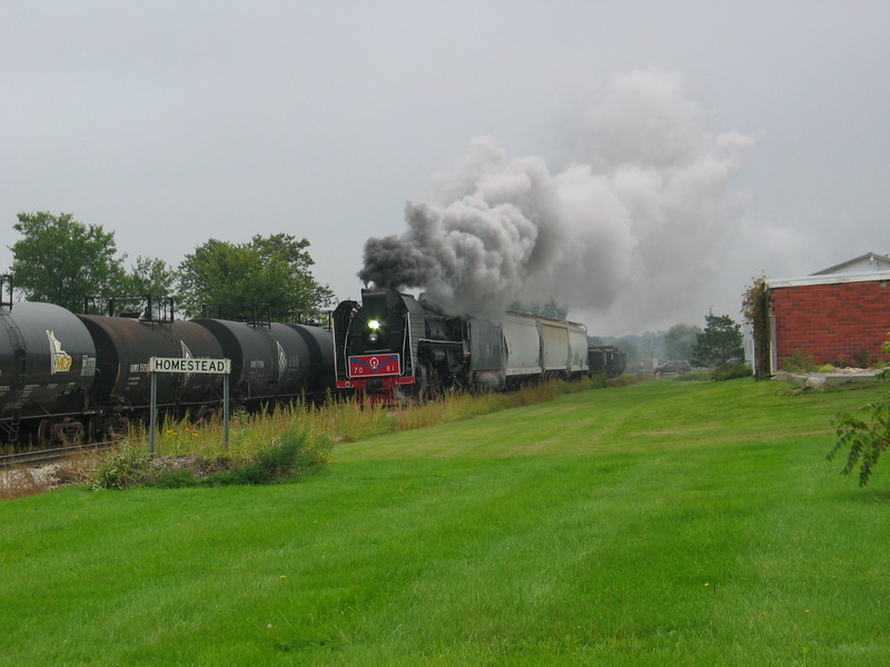 Steam extra pulling through Homestead, Sept. 9, 2006.  I think that most if not all of the train is Wilton cars out of Gerdau and JM!