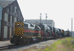 IAIS 711 passes the Williams White buildings at 6th Street Moline, IL on 27-Jun-2006.