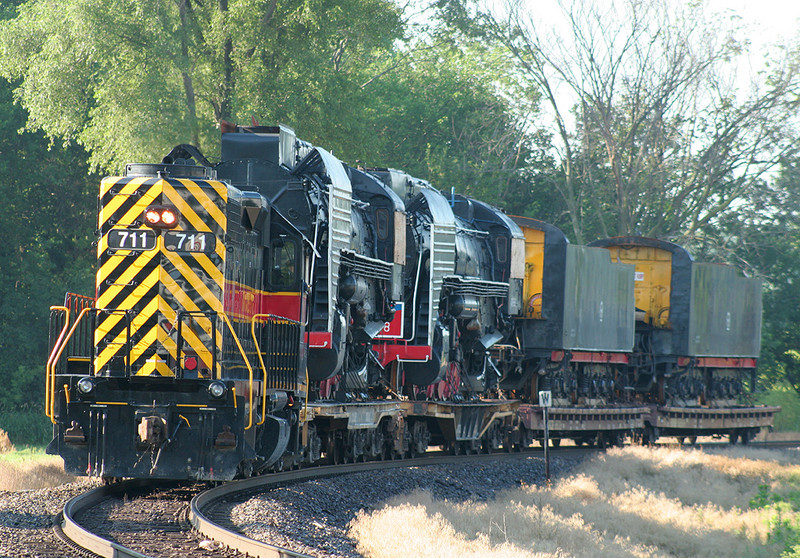 IAIS 711 couples onto the Chinese QJ's on BNSF trackage at Colona, IL on 27-Jun-2006 to tow them into Rock Island.