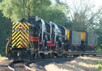 IAIS 711 couples onto the Chinese QJ's on BNSF trackage at Colona, IL on 27-Jun-2006 to tow them into Rock Island.