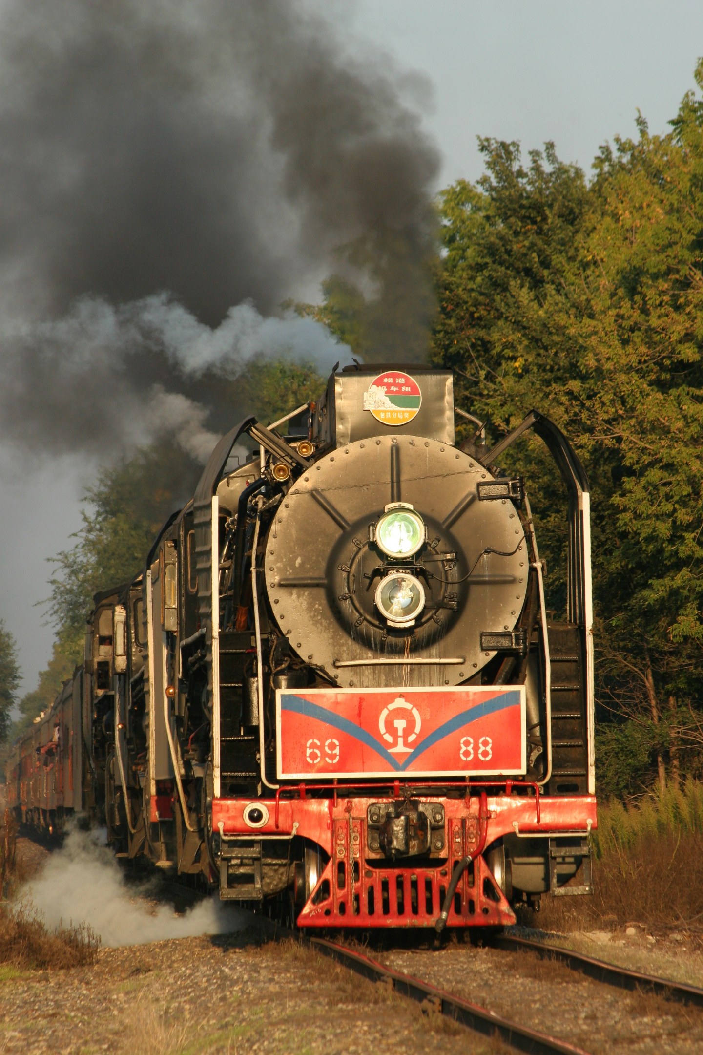 The returning train is approaching downtown Moline in the evening light