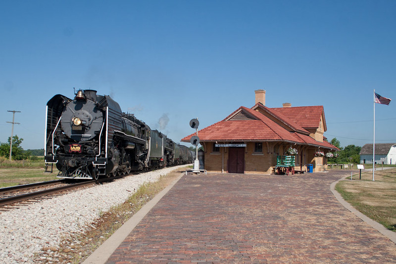 The 7,078 ton double-headed freight pulls past the depot at West Liberty, IA.