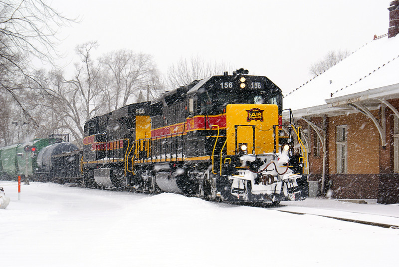 156 and 506 idle past the Iowa City depot.