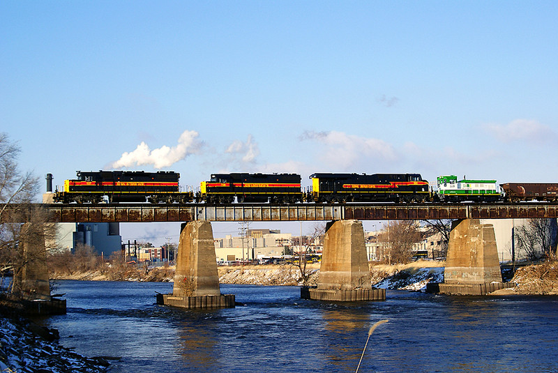 All the family present! SD38-2 157 leads the BICB with a GP38-2 and GEVO with SIRE switcher in transist.