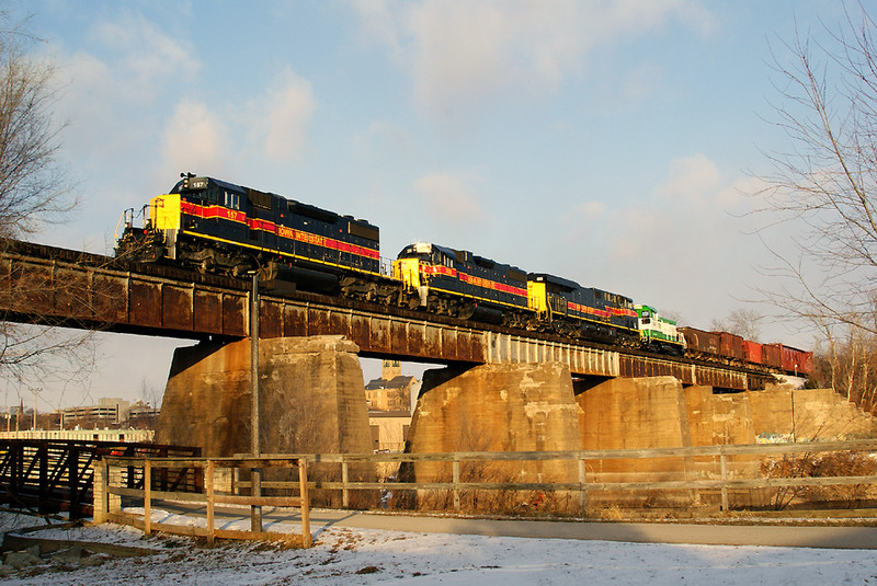 All the family present! SD38-2 157 leads the BICB with a GP38-2 and GEVO with SIRE switcher in transist.