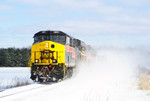 511 blows the snow as it crosses Eagle Avenue.