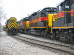 Coal train meeting the local at 1st Ave. Iowa City, Jan. 20, 2006.  In the background on the siding is the rear end of the RI turn.