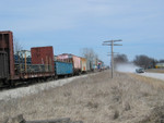 Re-rod load and other cars on the west train, at the Wilton pocket, March 19, 2006.  Gotta love that dusty gravel!