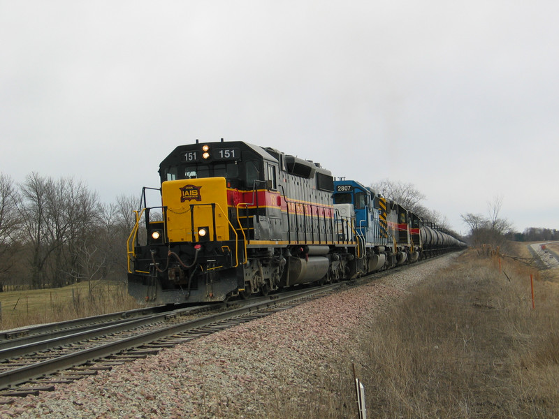 CR job goes onto the Crandic at Yocum.  Evidence of the recent brush cutting can be seen to the right.  March 20, 2006.