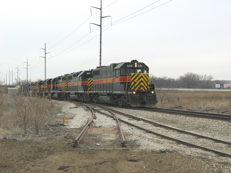 West train at the east end of Hawkeye siding.  Note the old point type derail on the former elevator track.  March 20, 2006.