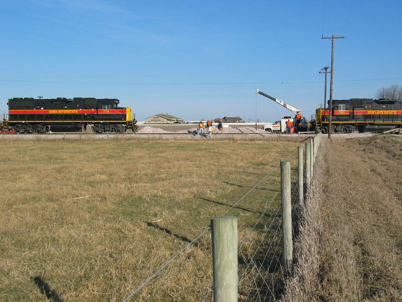 West train at the west Twin States crossing, while the track gang changes out a broken rail, Nov. 21, 2006.