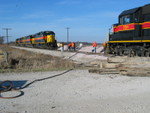 The track crew is jackhammering the spikes down on the new rail.  West end of Twin States siding, Nov. 21, 2006.