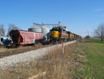 West train passes one of the fertilizer hoppers at Atalissa.  Nov. 21, 2006.