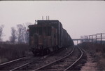 Eastbound freight heads toward West Liberty; notice the neat dwarf signal governing westbound movements on the siding.  Nov. 24, 1973.
