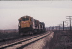 Westbound freight rounds my favorite curve east of Atalissa, April 26, 1975.