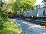 The crew is pulling their sand loads west on the main, past more sand loads, a tank for Chessie, 250, and cement empties for Buzzi at La Salle, Sept. 11, 2007.