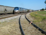 Pulling west down Silvis siding, past storage feed cars on the north and the switch to Anchor lumber on the main.