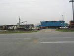 West train passes the track gang, preparing to work on the west switch at Twin States siding, Sept. 25, 2007.